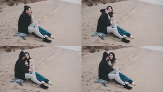 一对幸福的情侣在多云的日出中漫步在荒野的海滩上高清在线视频素材下载