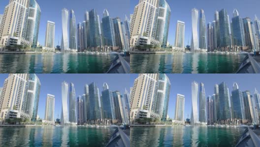 阿联酋，迪拜，2021年2月15日:迪拜码头的天际线，码头上的现代摩天大楼，豪华酒店和游艇在海湾的波浪中摇摆高清在线视频素材下载