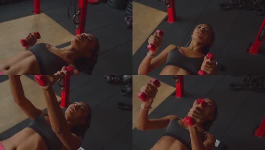 可爱的运动健身黑人女性哑铃卧推高清在线视频素材下载