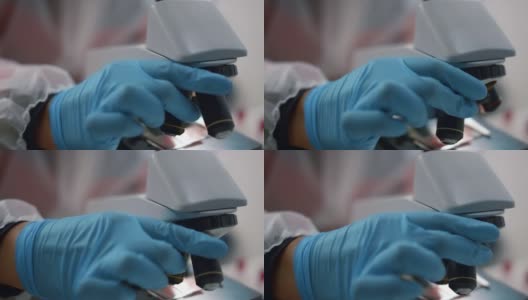 科学家在实验室使用显微镜。研究人员使用样本高清在线视频素材下载