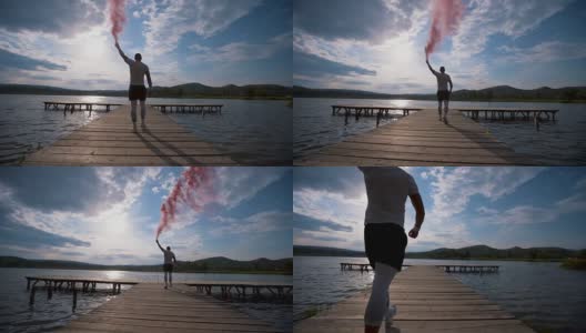 运动员在湖码头上举着火炬高清在线视频素材下载