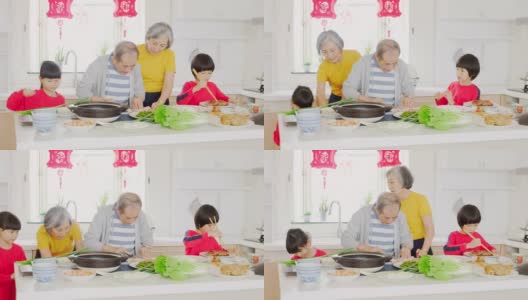 中国一家几代人在厨房里准备新年食物高清在线视频素材下载