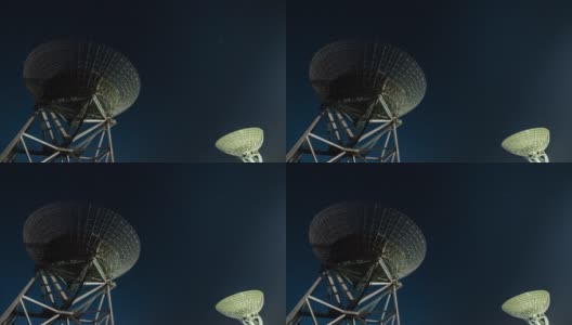 T/L卫星碟形天线在夜晚捕捉星星高清在线视频素材下载