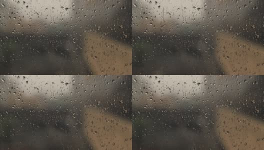 雨滴落在窗玻璃表面高清在线视频素材下载