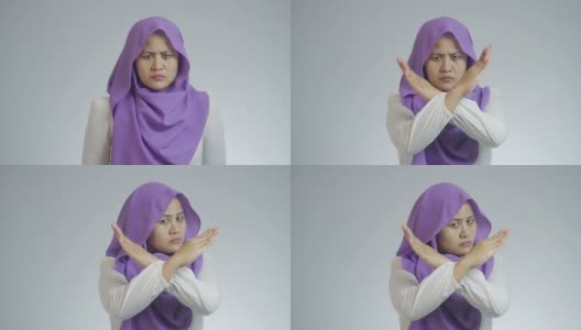 愤怒的穆斯林妇女双手交叉示意停车高清在线视频素材下载