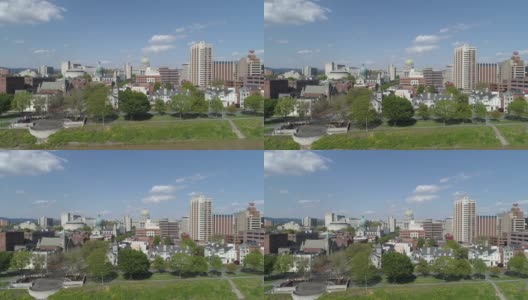 首都地区绿地和萨斯奎哈纳风景展望滨水公园在哈里斯堡，宾夕法尼亚州，与远观城市到州议会行政大楼。无人机拍摄的带有上升摄像机运动的航拍视频。高清在线视频素材下载