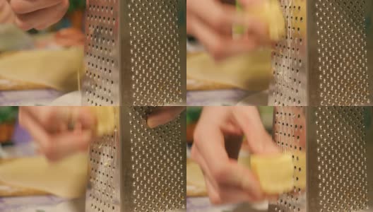 马苏里拉奶酪穿过磨碎的一片奶酪高清在线视频素材下载