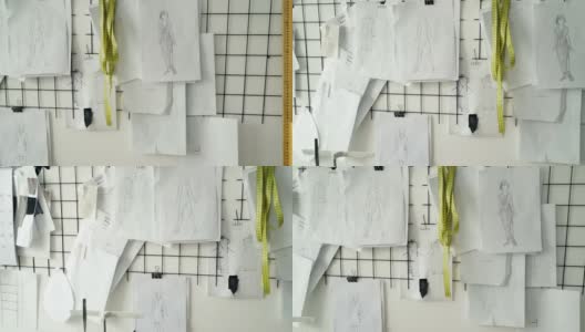 在服装设计工作室墙壁上拍摄的黑白草图、图纸和标注女装尺寸的笔记。创建新的集合概念。高清在线视频素材下载