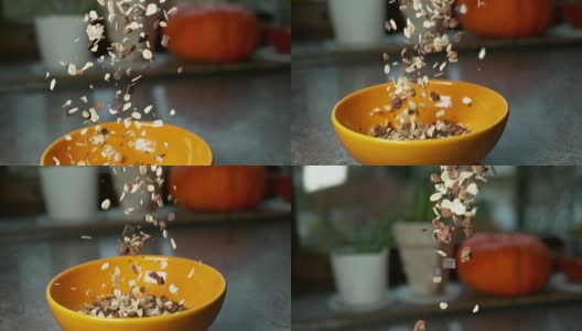 超级慢动作:将燕麦片、麦片和巧克力混合在碗里。高清在线视频素材下载