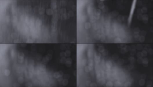 抽象的暗色调背景为大雨降落与小散景轻，恶劣天气天的概念高清在线视频素材下载