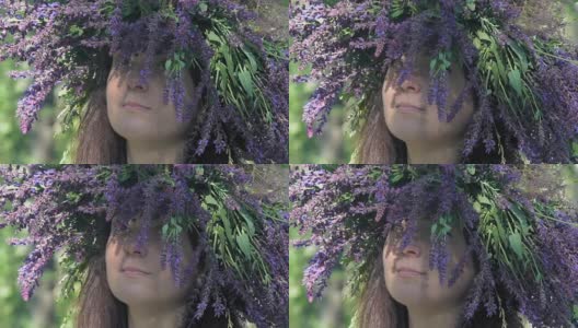 慢镜头，特写，美丽的女孩与一个花环的头从田野花矢车菊看起来Thought Up高清在线视频素材下载