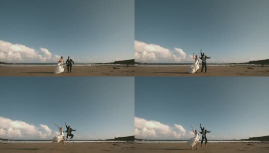 快乐的新婚夫妇在空中跳跃高清在线视频素材下载