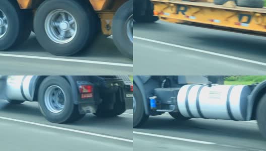 卡车在高速公路上行驶。卡车轮胎在柏油路上超速行驶的特写镜头高清在线视频素材下载