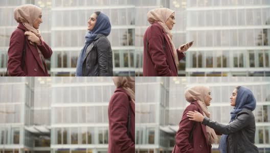 两位英国穆斯林女性朋友在办公室外聚会高清在线视频素材下载