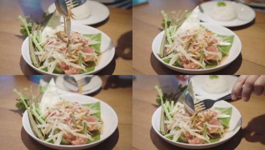 吃青瓜沙拉，用生木瓜丝做的辣沙拉。高清在线视频素材下载