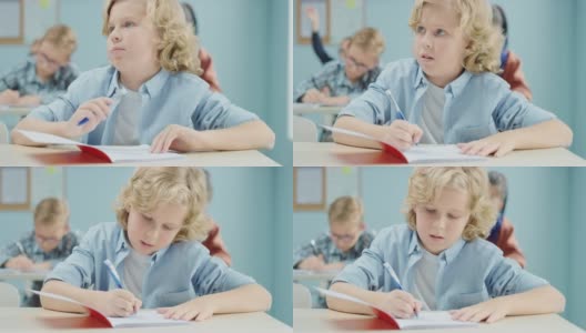 小学课堂:一个聪明可爱的白人男孩在练习笔记本上写字的肖像。初中教室与多元的聪明的孩子们努力工作，学习新东西高清在线视频素材下载