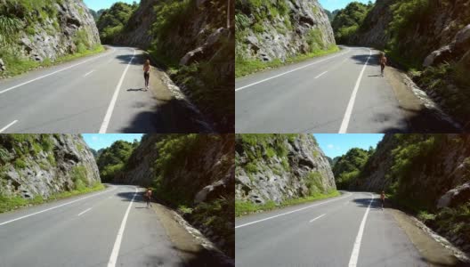 无人机显示女人在空旷的高速公路上奔跑高清在线视频素材下载