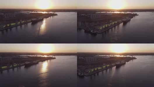 日落时飞过海港。港高清在线视频素材下载