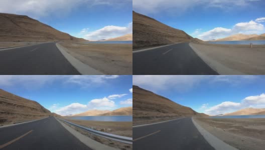 在中国西藏羊卓雍错湖边的小路上行驶高清在线视频素材下载