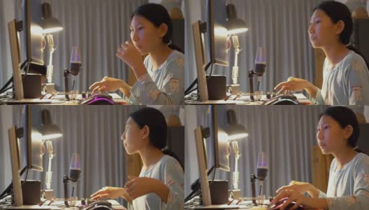 亚洲女孩晚上在家玩网络游戏直播，新潮的生活方式为新一代概念。高清在线视频素材下载