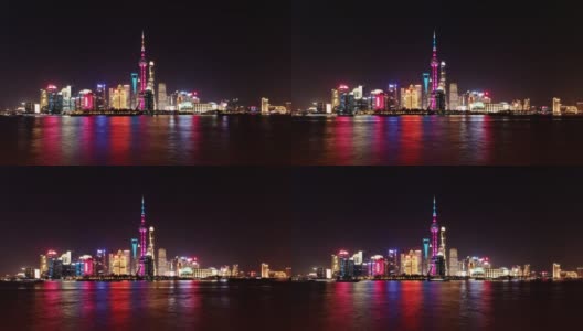 夜间从外滩俯瞰上海的天际线，摩天大楼和地标建筑与黄浦江上的船只，延时4k胶卷b滚动拍摄。高清在线视频素材下载