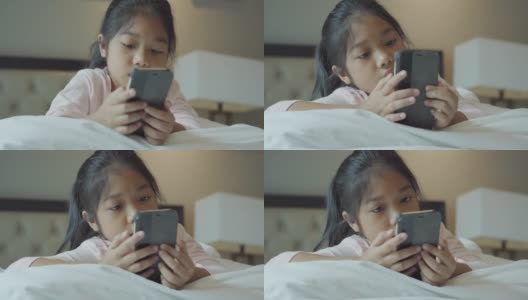 小女孩在卧室里使用科技社交媒体。高清在线视频素材下载