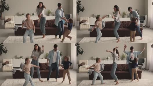 一对夫妇带着孩子在客厅跳舞高清在线视频素材下载