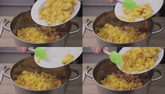 煮土豆，切土豆和准备土豆揉成奥利维尔沙拉，准备沙拉的概念高清在线视频素材下载