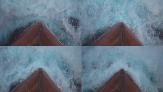 海浪拍打船首的泡沫飞溅-慢动作。高清在线视频素材下载