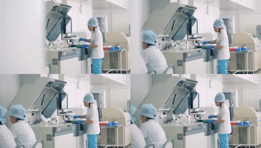 自动化实验室设备与工人在药品生产。高清在线视频素材下载