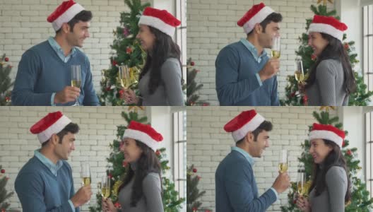 这是一对可爱的夫妇在圣诞庆典上喝酒跳舞的慢镜头。高清在线视频素材下载