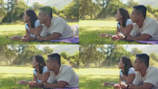 一对年轻情侣在外面的公园里约会的4k视频高清在线视频素材下载