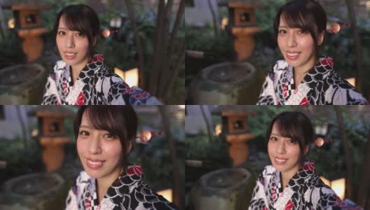 一名日本女子在日本的小花园里拍视频高清在线视频素材下载