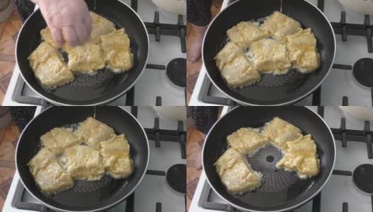 厨师在平底锅里煎鱼高清在线视频素材下载