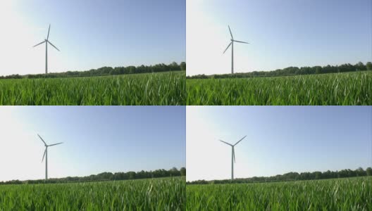 蓝天上的绿草风力涡轮机回路高清在线视频素材下载
