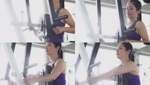 年轻女子在健身房锻炼高清在线视频素材下载