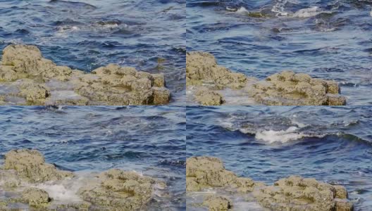 意大利海岸上的大石头伴随着海浪高清在线视频素材下载