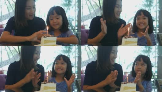 女孩和妈妈一起享用生日蛋糕高清在线视频素材下载