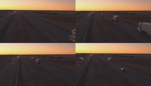 汽车和货车在高速公路上行驶。黎明时货物运输高清在线视频素材下载