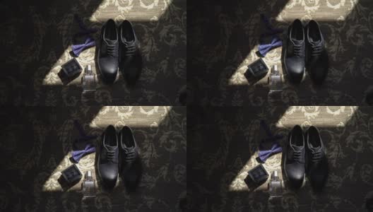 男士鞋，蝶形领结，袖扣和香水高清在线视频素材下载