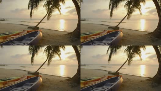 日出时沙滩上的皮划艇高清在线视频素材下载