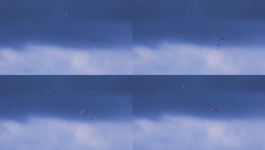 对抗穆迪天空的滑翔伞组高清在线视频素材下载
