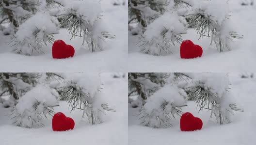 红心躺在雪地上。雪落。浪漫。情人节快乐。情人节快乐。高清在线视频素材下载