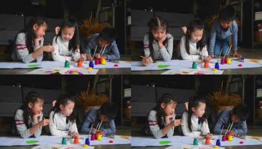 一群孩子在纸上画画高清在线视频素材下载