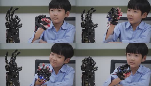 亚洲发明家孩子组装和测试机器人反应在实验室。建筑师小孩子设计电路技术想法和协作开发机器人。高清在线视频素材下载