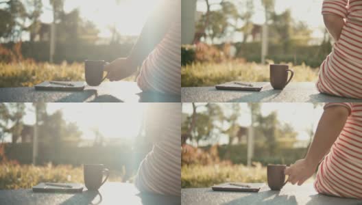 多莉拍摄的女人在早上喝茶，慢镜头高清在线视频素材下载