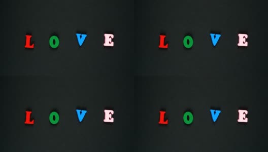“爱”字由彩色木制字母组成。丰富多彩的文字循环。定格动画高清在线视频素材下载