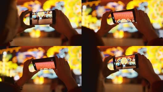 中国春节期间，女人用智能手机与城市景观高清在线视频素材下载