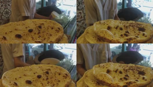 皮塔面包，阿拉伯面包，叙利亚面包，阿拉伯库布兹面包，坦杜尔的印度扁面包高清在线视频素材下载