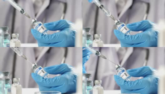 医生将疫苗注射到注射器上高清在线视频素材下载